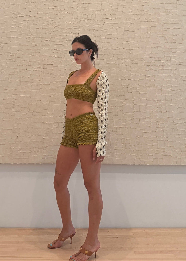 model wearing moss magic mini shorts 