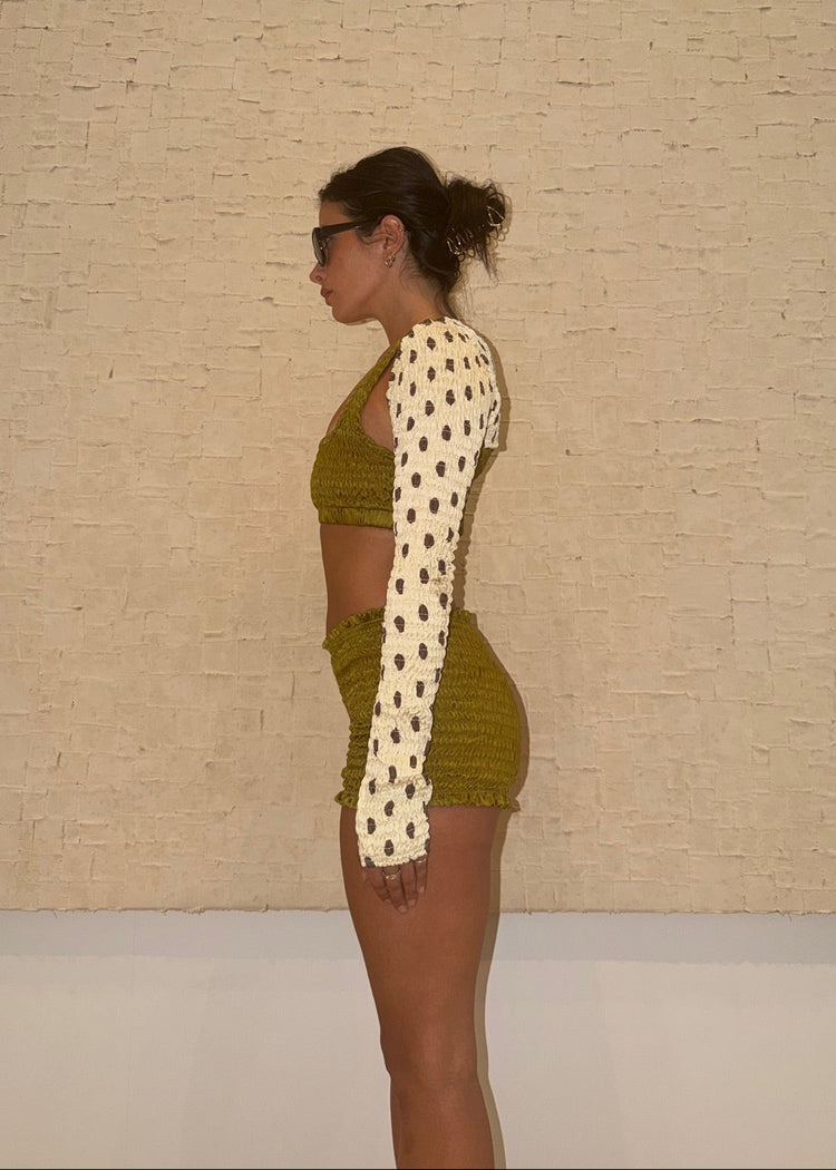 model wearing moss magic mini shorts 