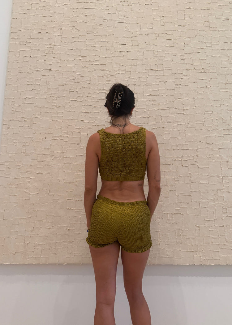 model wearing moss magic mini shorts 