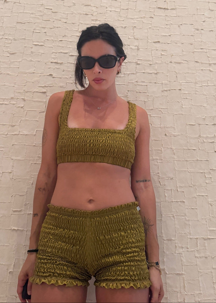 model wearing moss magic mini shorts 